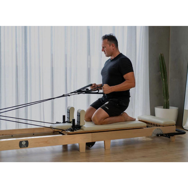 Man Using Core Collab Eco Warrior Foldable Pilates Reformer