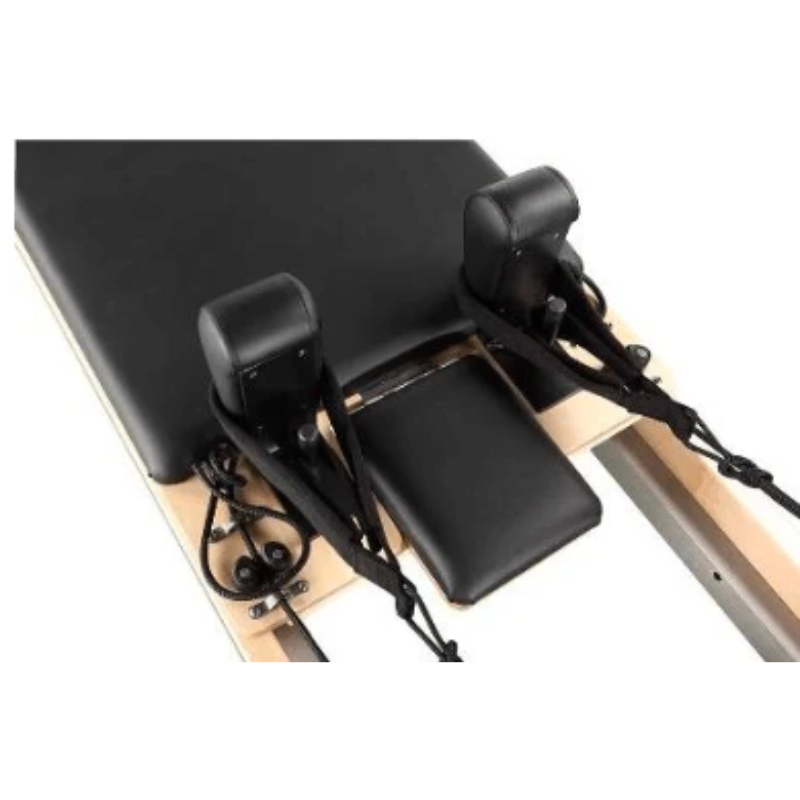 Close-up of the headrest and shoulder blocks on the carriage of Core Collab Full Track Eco Studio Pilates Machine in Black