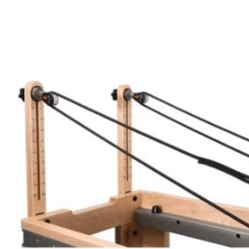 Close-up of the pulley risers and ropes on the Core Collab Full Track Eco Studio Pilates Reformer Machine in Black