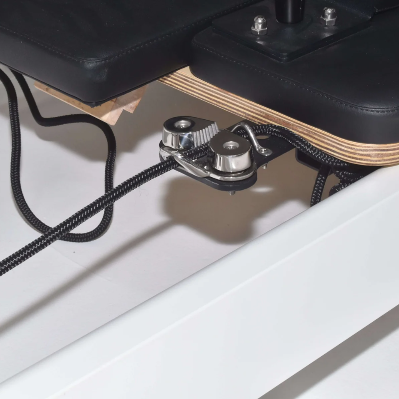 Close-up of the metal rope cleat on the Core Collab Queen Studio 2.0 Pilates Machine