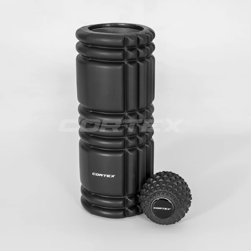 Cortex GridSoft EPP Foam Roller in an upright position with the Massage Ball next to it