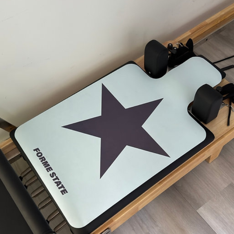 Forme State Pilates Reformer Mat in Scout in a home studio