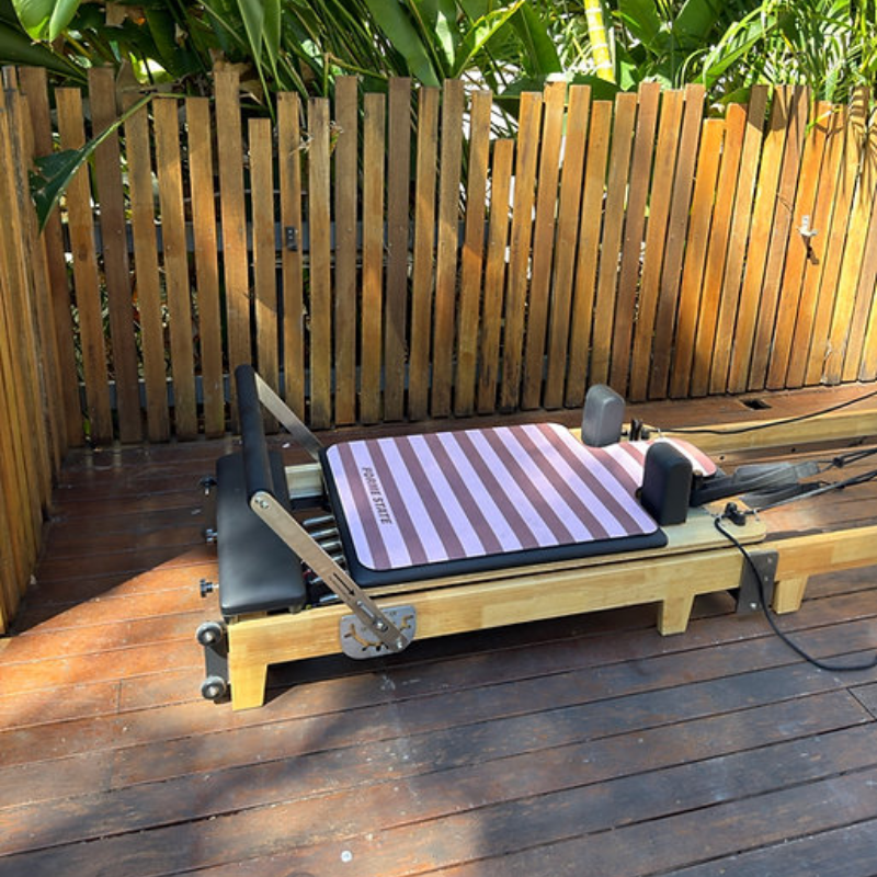 Forme State Pilates Reformer Mat in Sunday in a home backyard