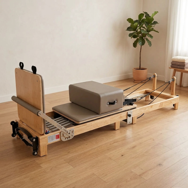 Impact Fitness Foldable Pilates Reformer inside a home lounge