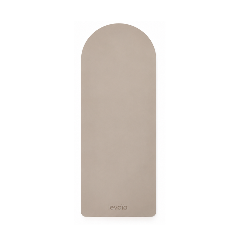 levaïa Pilates & Yoga Mat in Taupe, shown from above with an arched top and levaïa logo near the bottom.