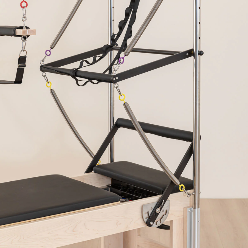 Close-up of the handle bar and springs on the Lifespan Fitness Contour Cadillac Pilates Reformer with Full Trapeze frame