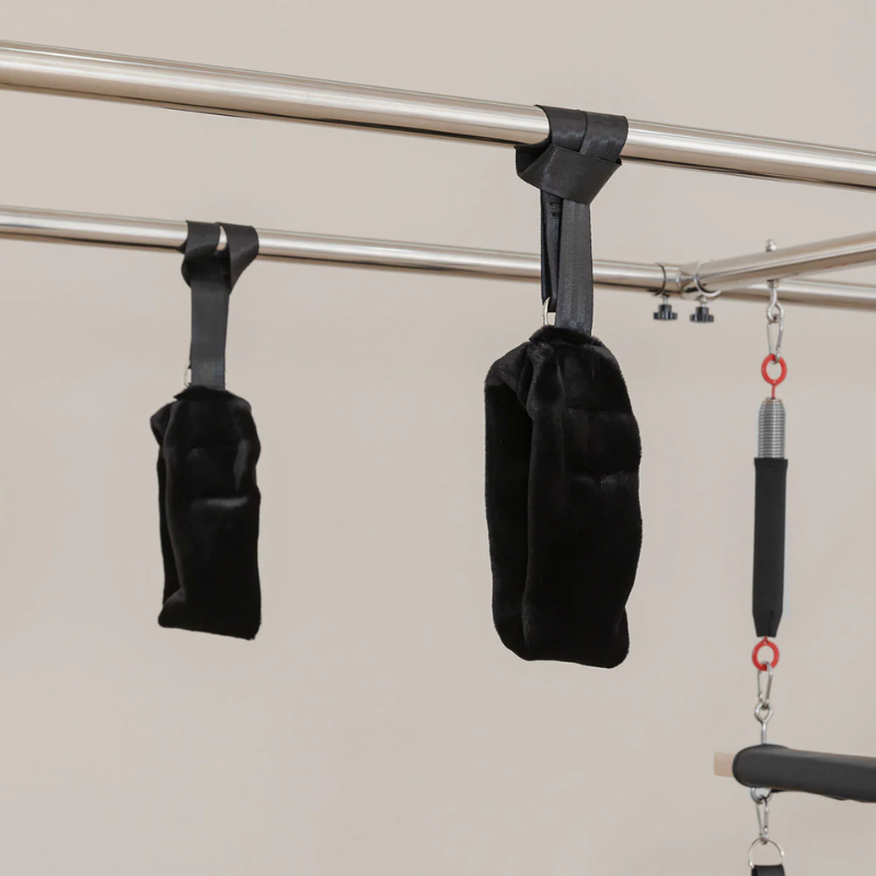 Soft hand and foot handle loops on the Lifespan Fitness Contour Cadillac Pilates Reformer with Full Trapeze frame