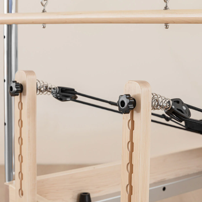 Close-up of the back view of pulley risers on the Lifespan Fitness Contour Pilates Reformer with Full Trapeze Table