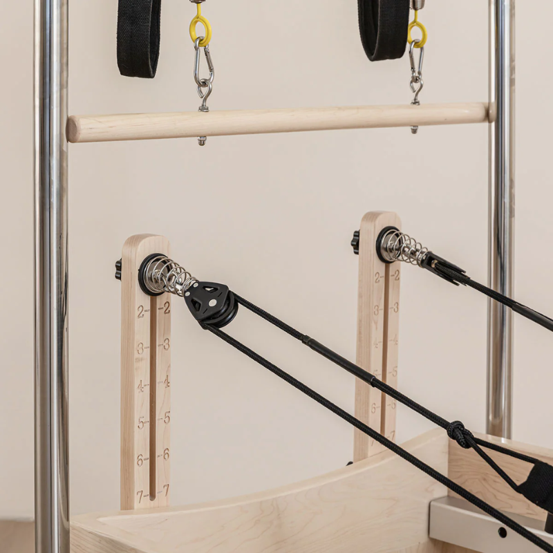 Close-up of the pulley risers on the Lifespan Fitness Contour Cadillac Pilates Reformer with Full Trapeze Table