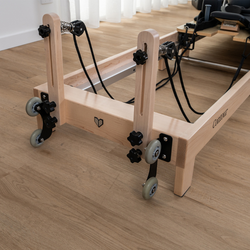 Close-up of the rope pulleys on Lifespan Fitness Contour Folding Wooden Pilates Reformer Machine