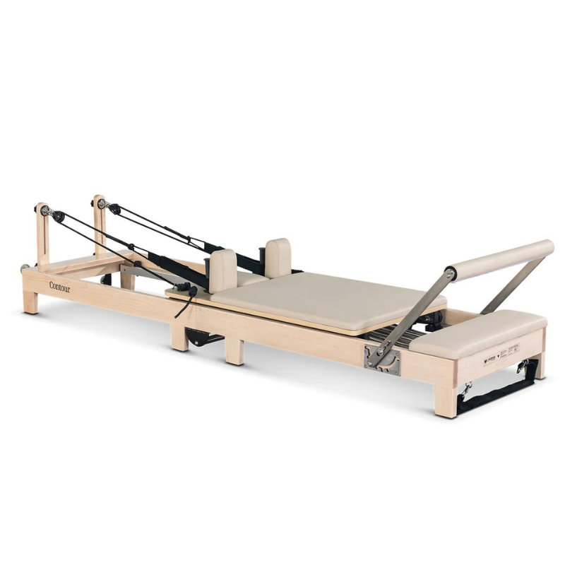 Front angle view of the Contour folding wooden pilates reformer machine in Beige