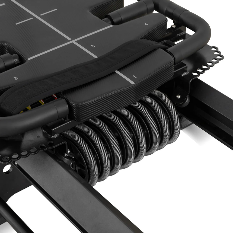 Close-up of carriage and springs on the Lifespan Fitness Contour Lagree-Inspired Reformer