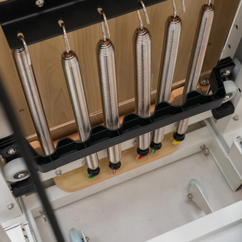 Close-up of springs underneath the carriage of Lifespan Fitness Contour Pro Aluminium Folding Pilates Reformer Machine