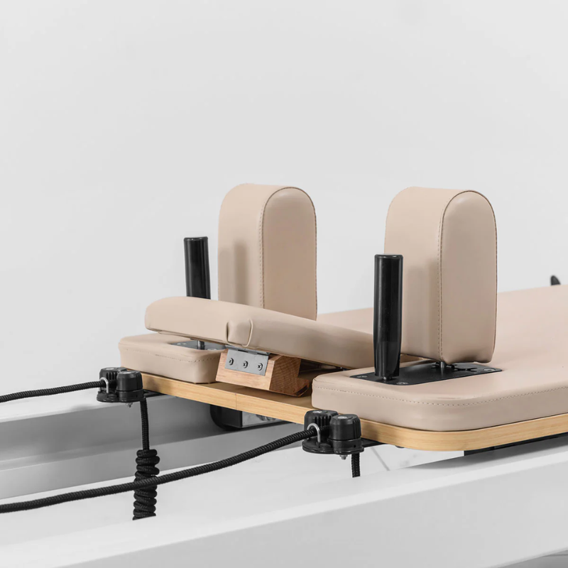 Close-up of the shoulder and heat rests on the Lifespan Fitness Contour Studio Commercial Pilates Reformer Machine in Beige colour