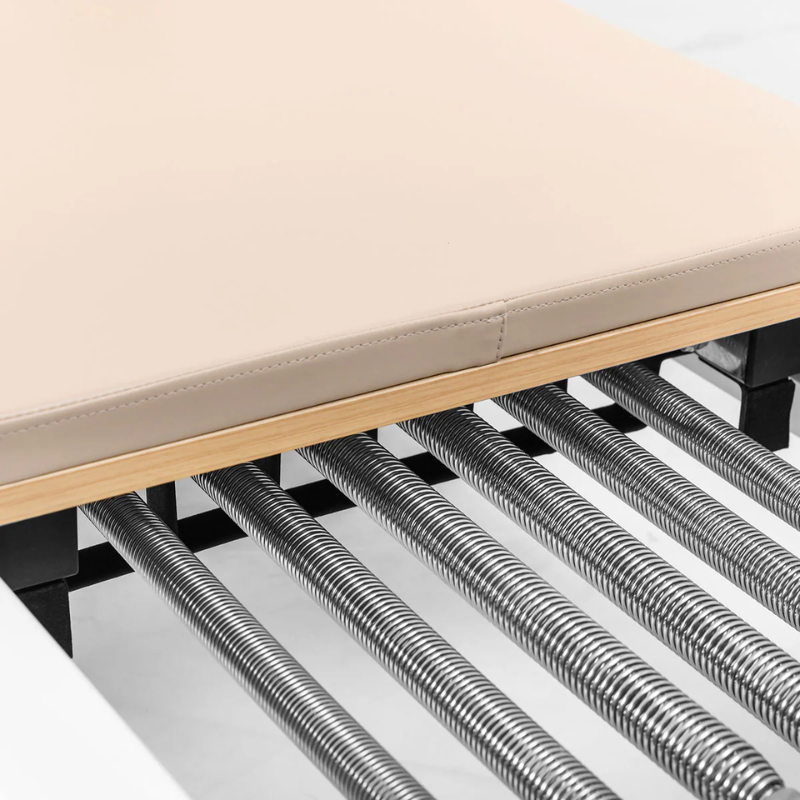 Close-up of the springs on the Lifespan Fitness Contour Studio Commercial Pilates Reformer Machine in Beige colour