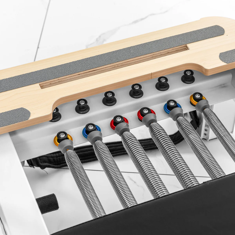 Close-up of the springs on the Lifespan Fitness Contour Studio Commercial Pilates Reformer Machine