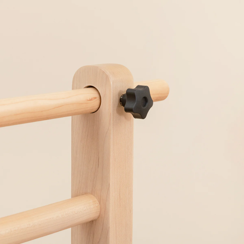 Close-up of a top adjustable screw on the Lifespan Fitness Pilates Ladder Barrel