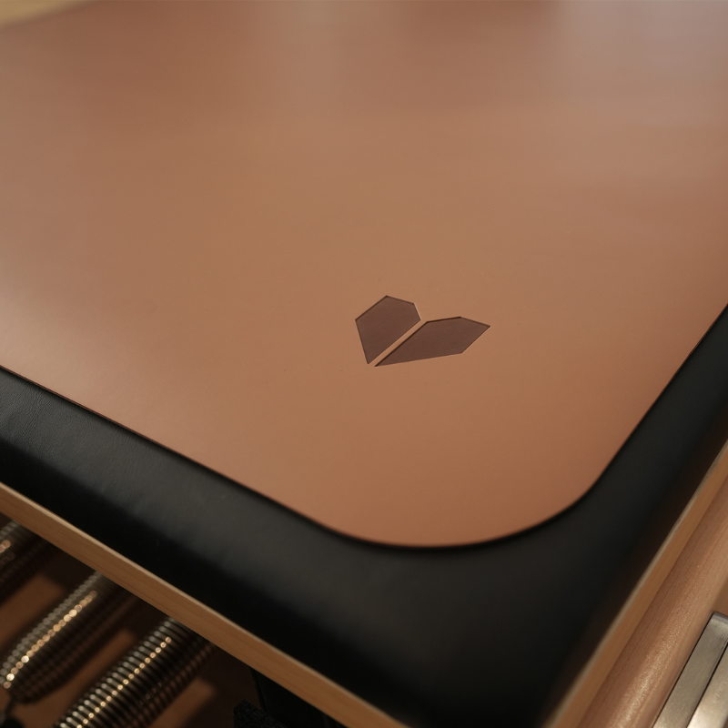 Close-up of the Lifespan Fitness Pilates Reformer Mat in Espresso on a Pilates reformer