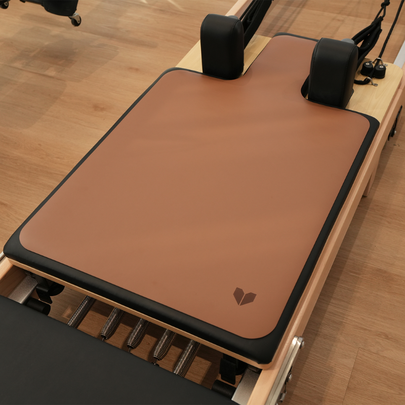 Lifespan Fitness reformer mat in Espresso on a Pilates reformer