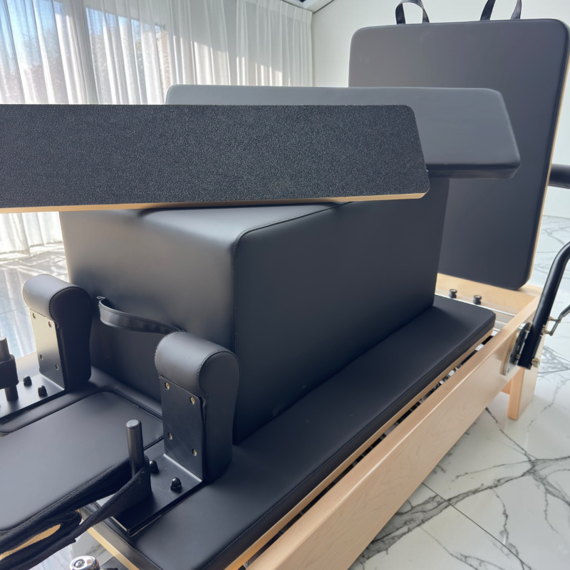 Close-up of both grip and padded standing platforms on Pilates box for Milaron Maple V3 Studio Reformer Pilates Machine
