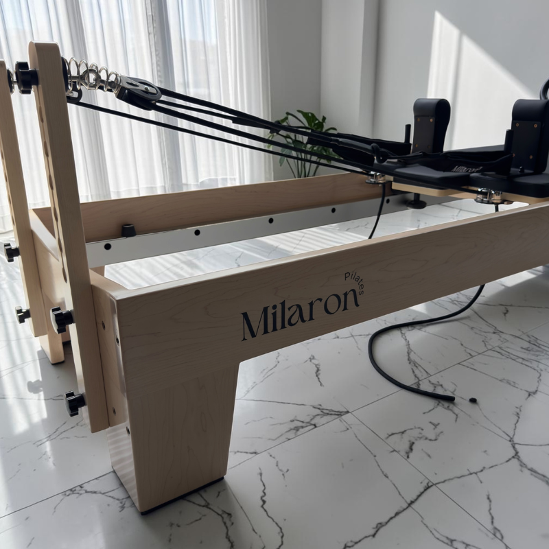Pulley risers and ropes on Milaron Maple V3 Studio Reformer Pilates Machine