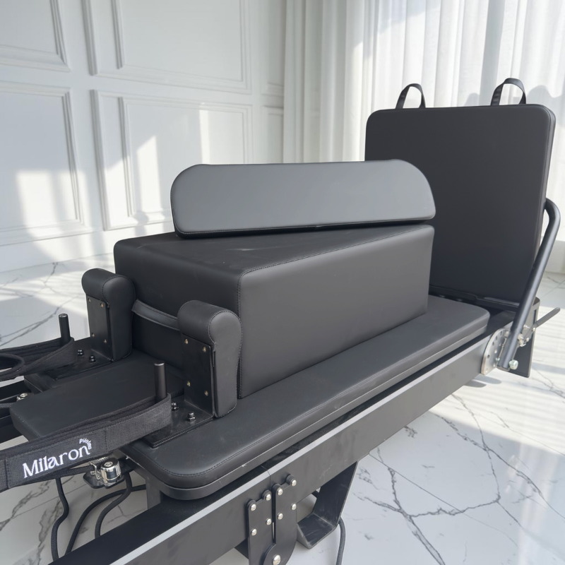 Closer view of Pilates box and padded standing platform sitting on carriage of Milaron Pearl V3 Foldable Reformer Pilates Machine in Noir
