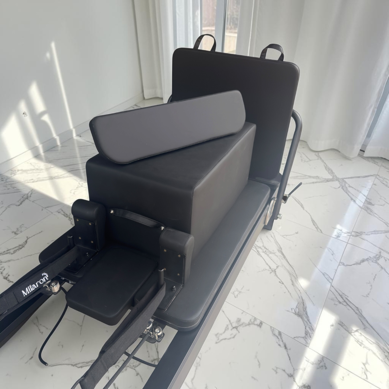 Pilates box and standing platform sitting on carriage of Milaron Pearl V3 Commercial Pilates Reformer in Noir