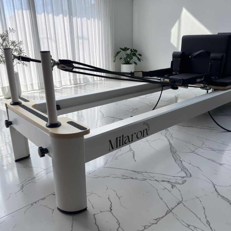 Pulley risers and rope on the Milaron Pearl V3 Studio Pilates Reformer in Original