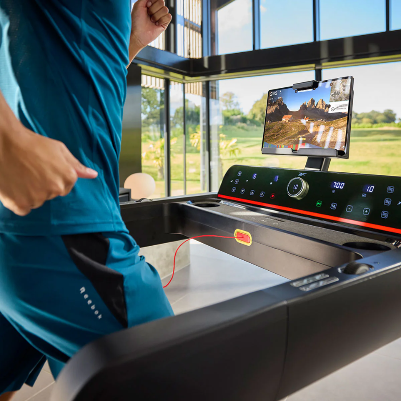 Close-up of the control screen while a man is running on the Reebok Z-Tech Treadmill
