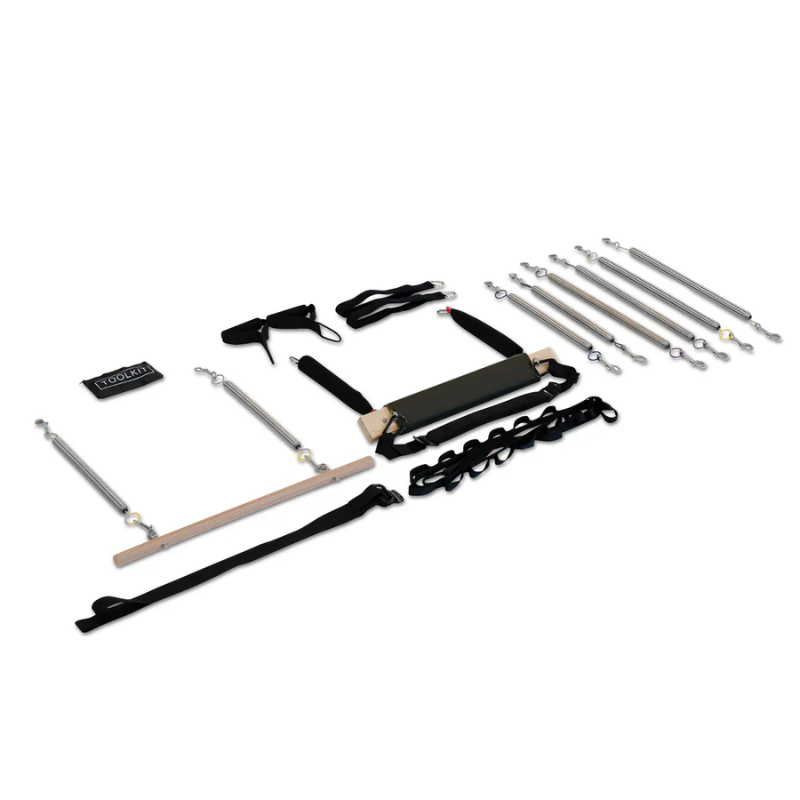Flatlay view of all attachments and parts of the Reeplex Cadillac Pilates Reformer with Full Trapeze V2