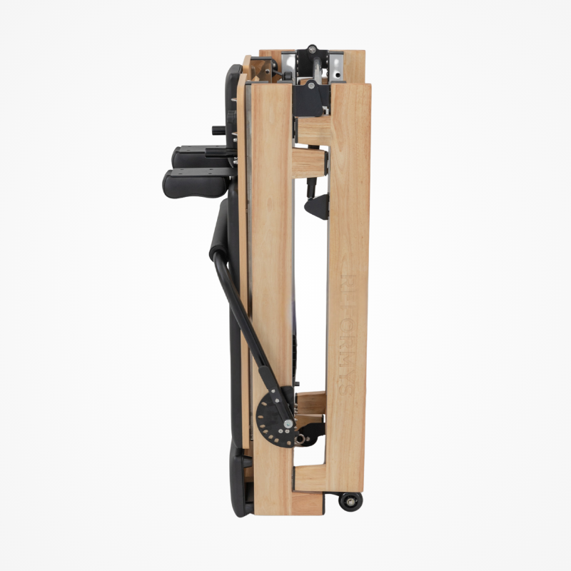 Side view of the Reformys Cloud Portable Pilates Reformer in Black in folded position