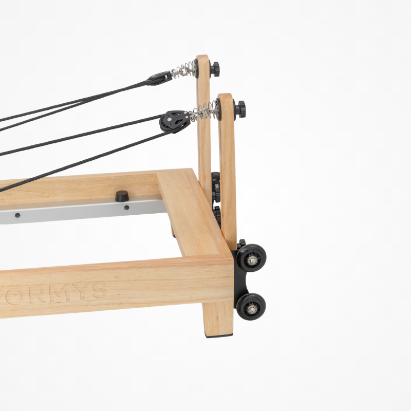 Side angled view of the pulley risers on the Reformys Cloud Portable Pilates Reformer in Black