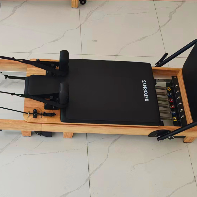 Reformys Pilates Reformer Mat in Black on a Pilates reformer machine
