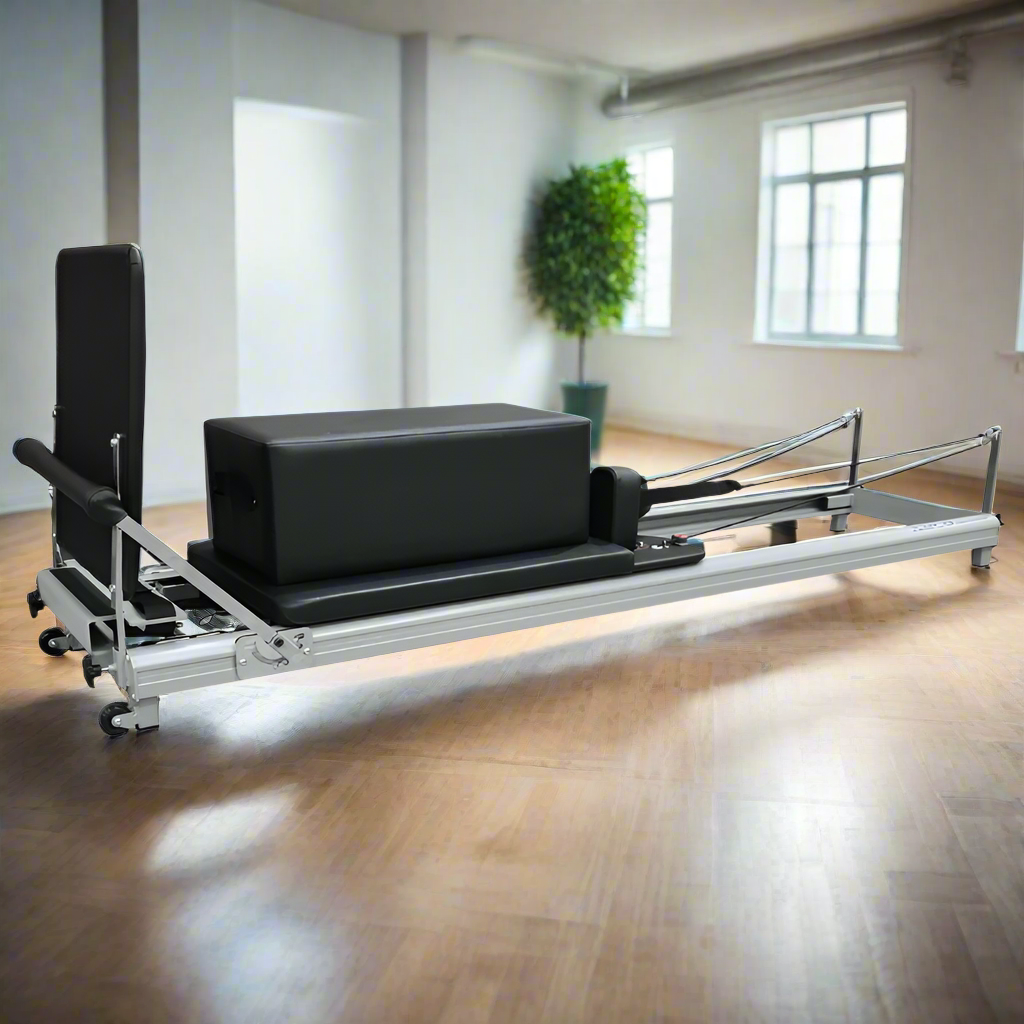 ABCO Low Pilates Reformer Machine Set in a studio