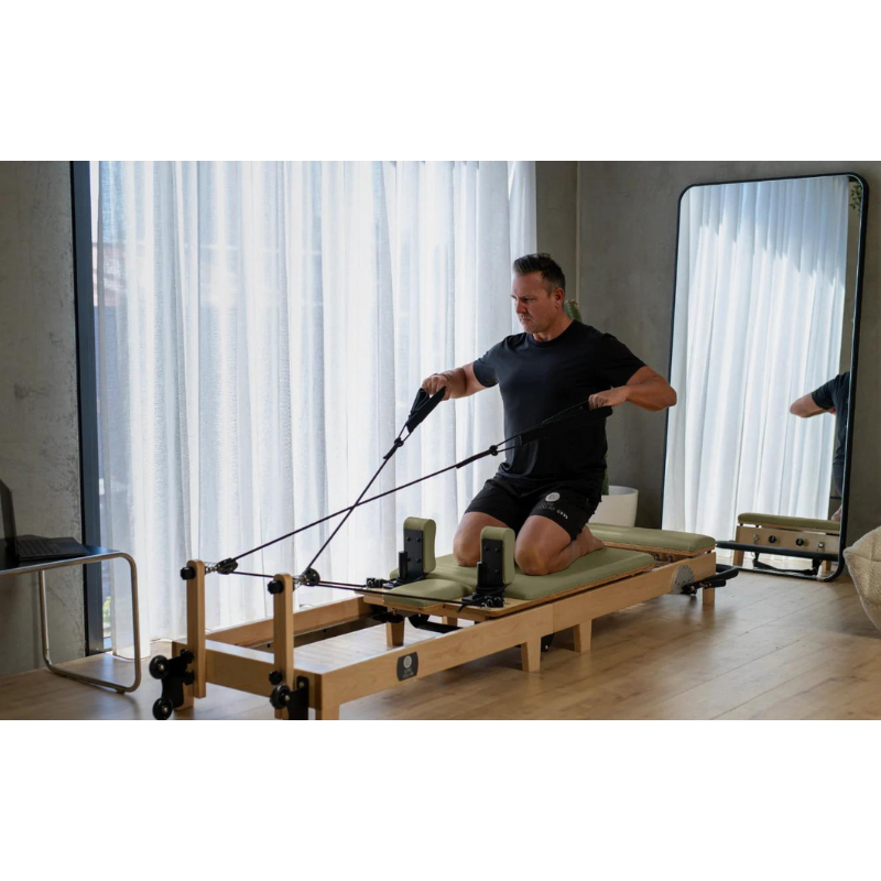 Man Using Core Collab Foldable Eco Pilates Reformer - Customised by You in Olive