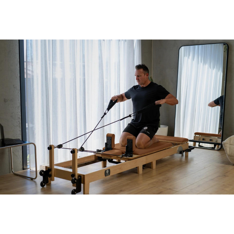 Man Using Core Collab Foldable Eco Pilates Reformer - Customised by You in Tan