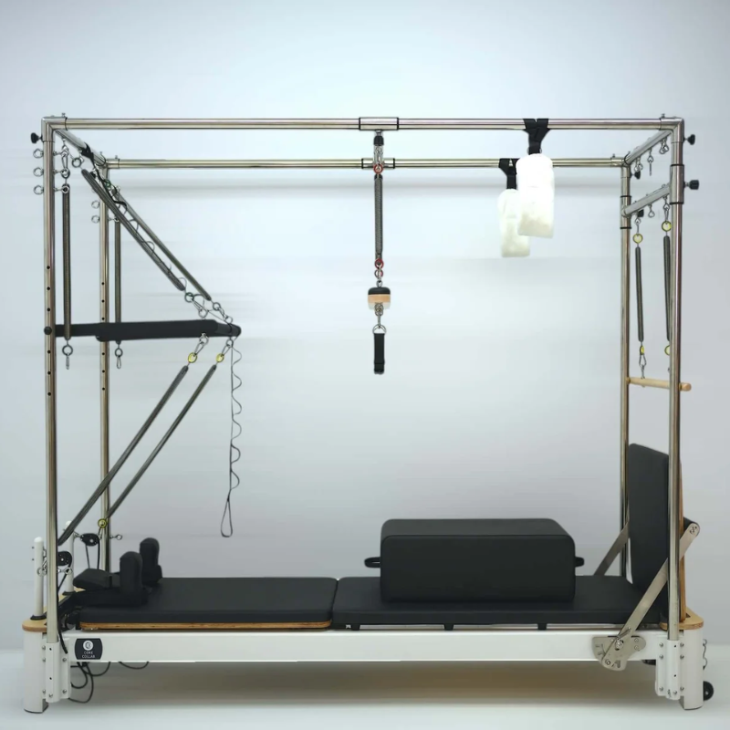 Full side view of the Core Collab Queen Cadillac Pilates Reformer with full trapeze table