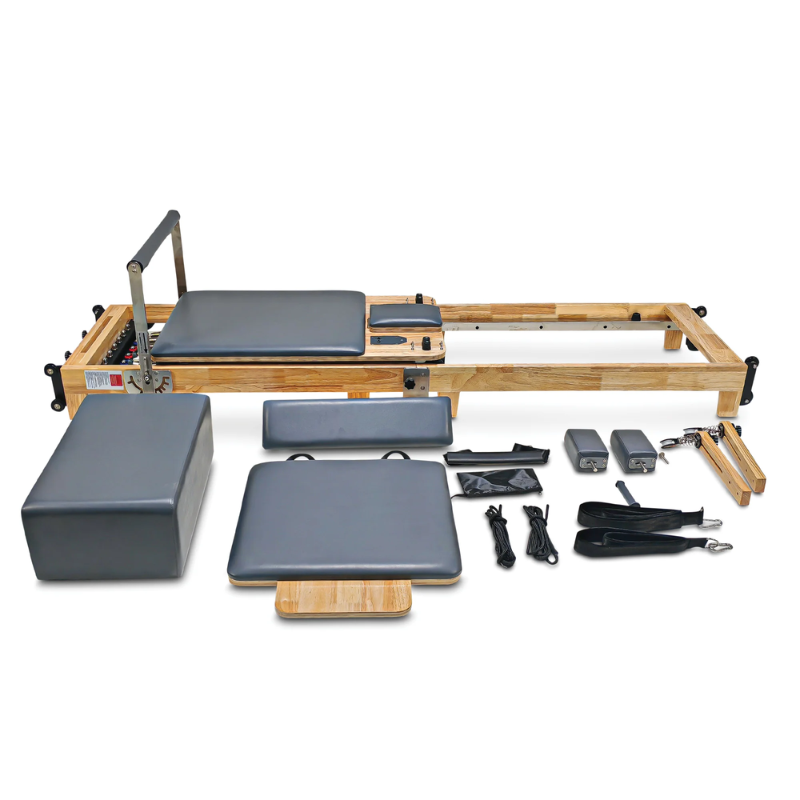 Impact Fitness Folding Pilates Machine for Reformer in Dark Grey colour with all included accessories and parts laid in front of it