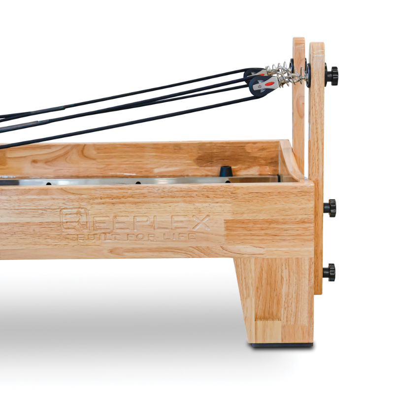 Back of the Impact Fitness Oak Wood Pilates Reformer Machine