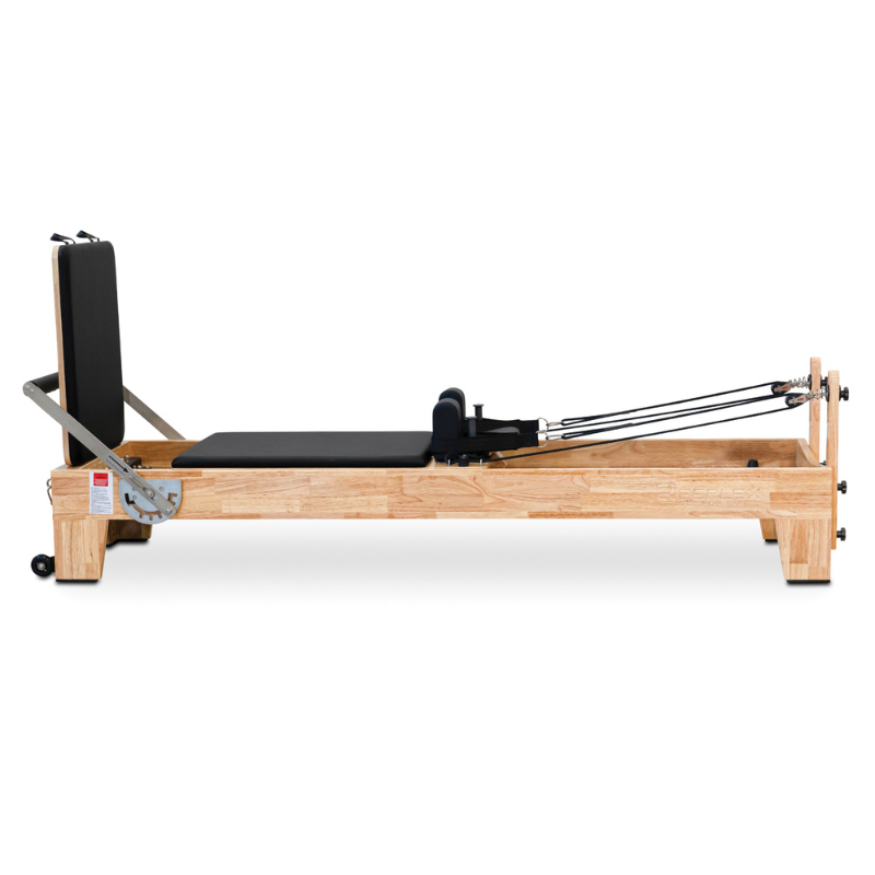 Side view of Impact Fitness Oak Wood Pilates Reformer Machine