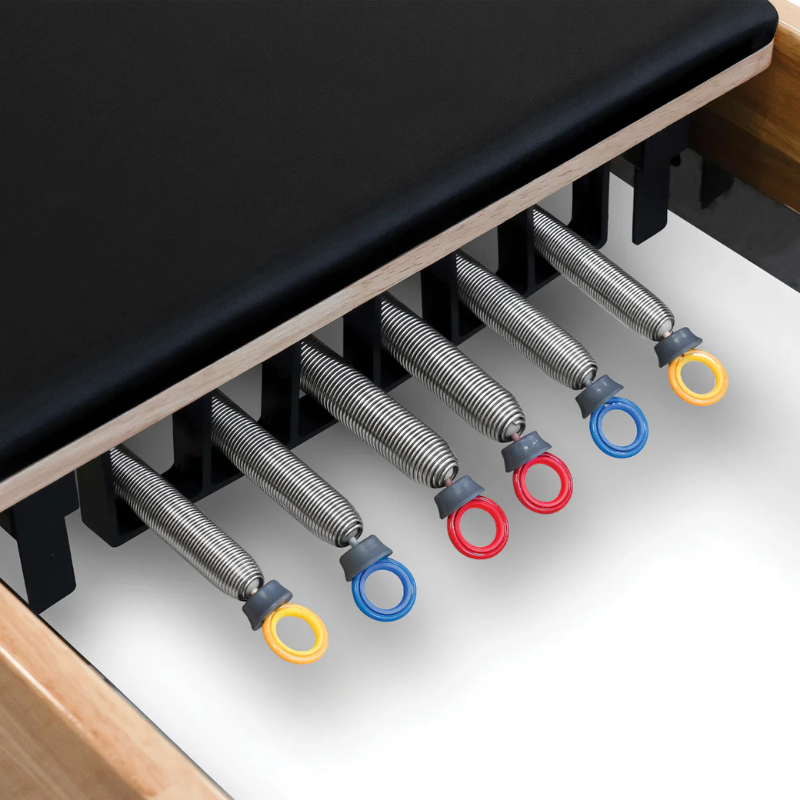 Close-up of the springs while unattached on the Impact Fitness Pilates Reformer with Half Trapeze Tower