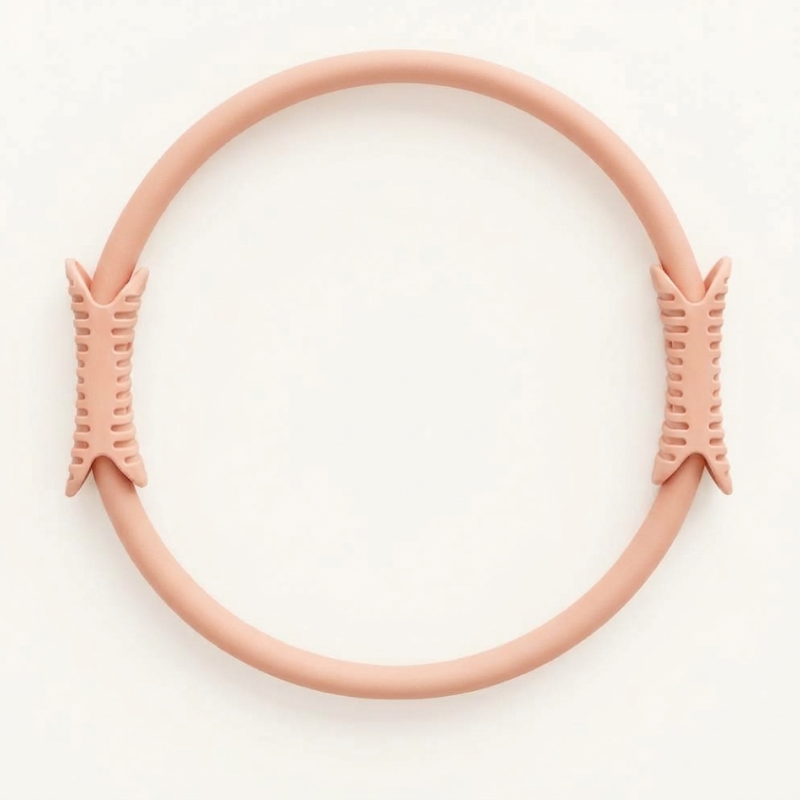 levaïa Pilates Ring in Blush, showing its circular design with two textured handles on opposite sides against a white background.