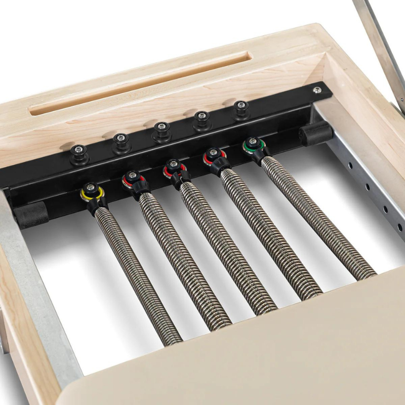 Close-up of the springs on Lifespan Fitness Contour Folding Wooden Pilates Reformer Machine in Beige