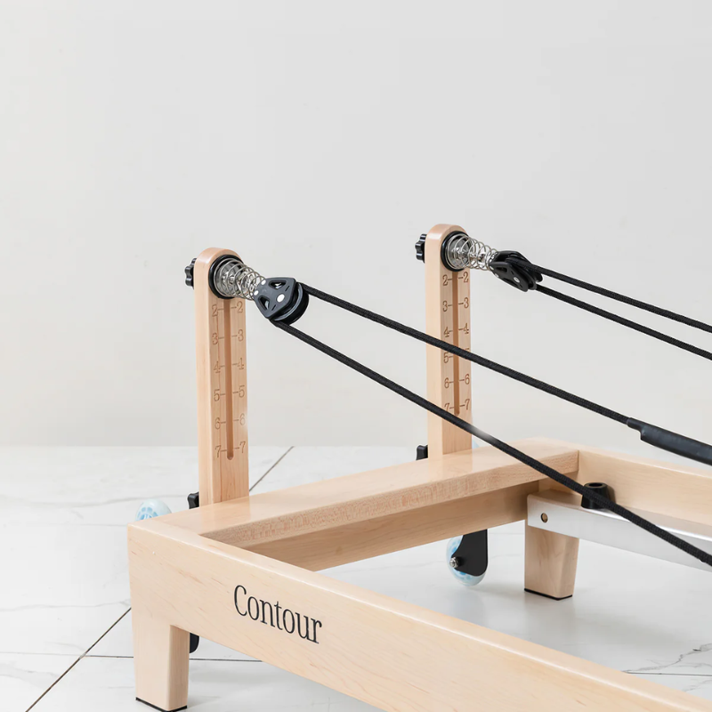 Front close-up view of the pulleys on the Lifespan Fitness Contour Folding Wooden Pilates Reformer Machine