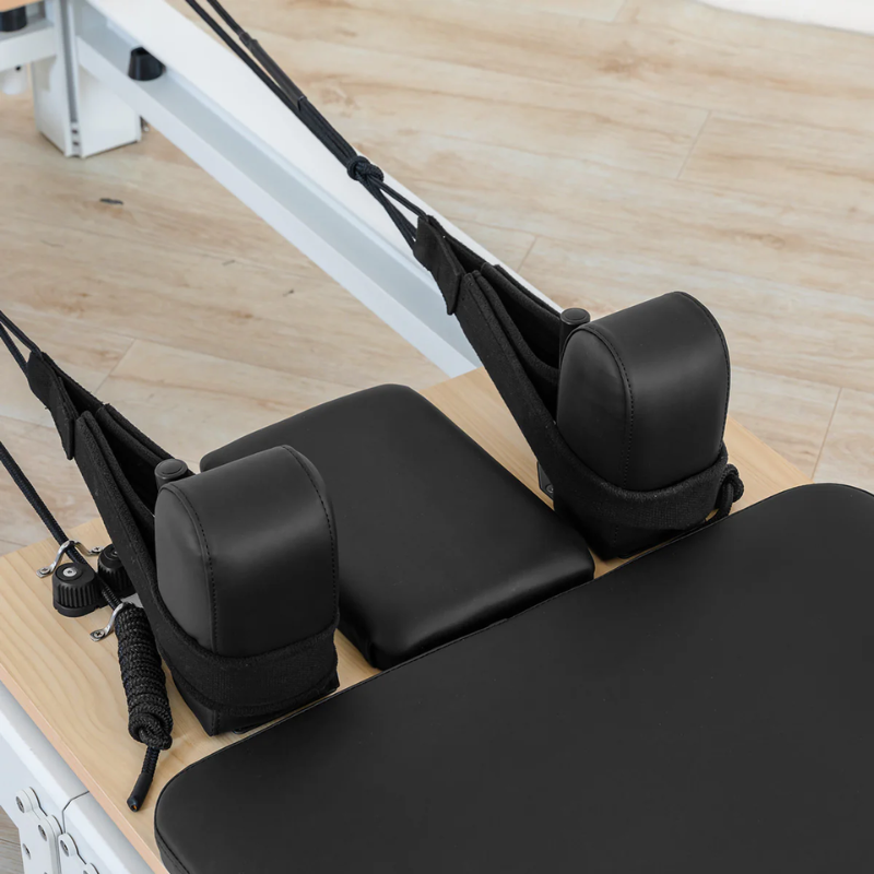 Close-up of the shoulder blocks, headrest and handles on the Lifespan Fitness Contour Pro Aluminium Folding Pilates Reformer Machine in black