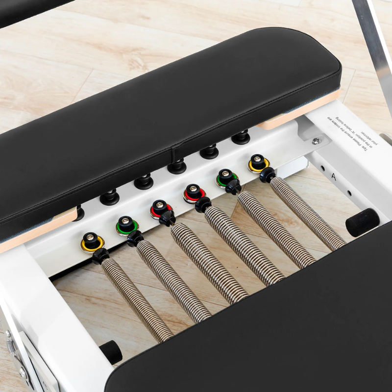 Angled close-up view of the springs on the Lifespan Fitness Contour Pro Folding Pilates Reformer in Black