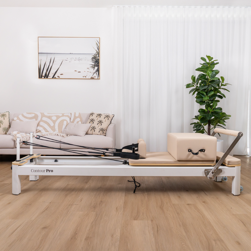 The Lifespan Fitness Contour Pro Aluminium Pilates Reformer Machine in a home lounge