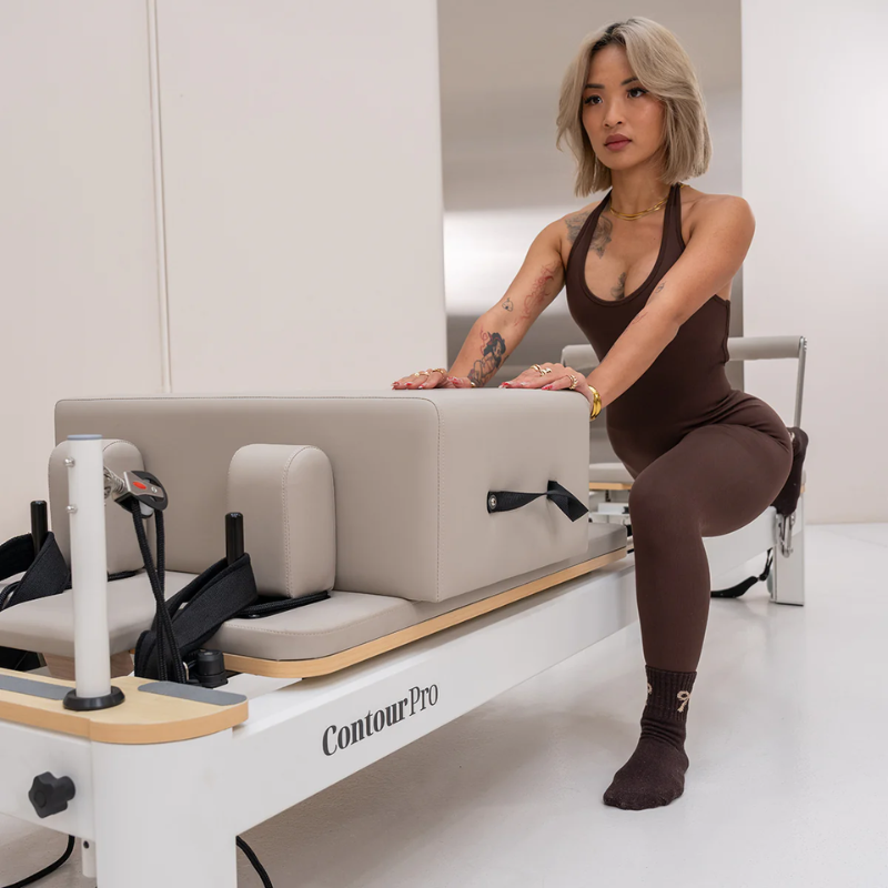 Woman working out on the Lifespan Fitness Contour Pro Aluminium Reformer Pilates Machine in Hepburn