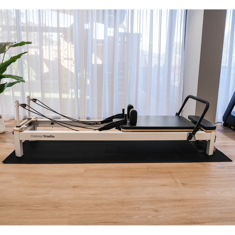 Contour Studio Commercial Reformer set up on the Lifespan Fitness Exercise Equipment Floor Protection Mat