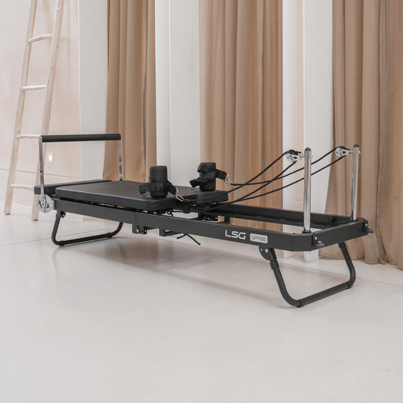 LSG GPR100 Foldable Pilates Reformer Machine inside a minimalist studio room
